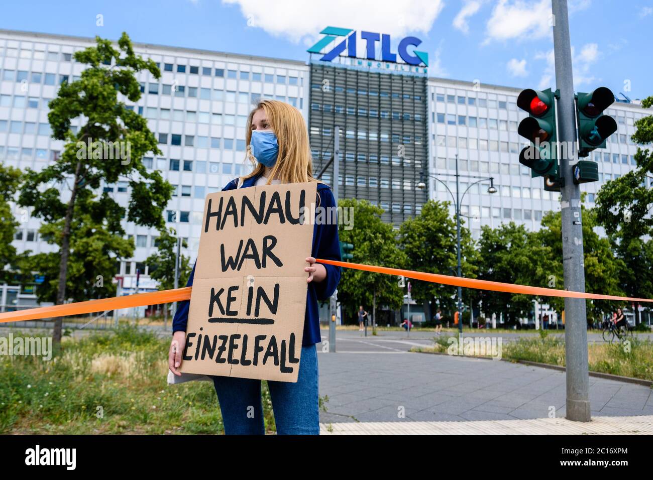 June 14, 2020, Berlin, Berlin, Germany: A woman holding a sign reading ' Hanau war kein Einzelfall' [engl. Hanau was not an isolated incident] can  be seen while several thousand people, various alliances,