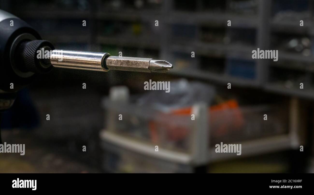 Drill Impact Driver with phillips head bit and extension close up