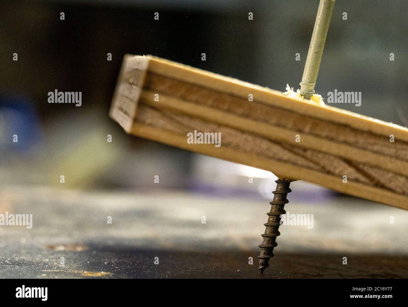Screw-in plywood at an angle close up mistake Stock Photo