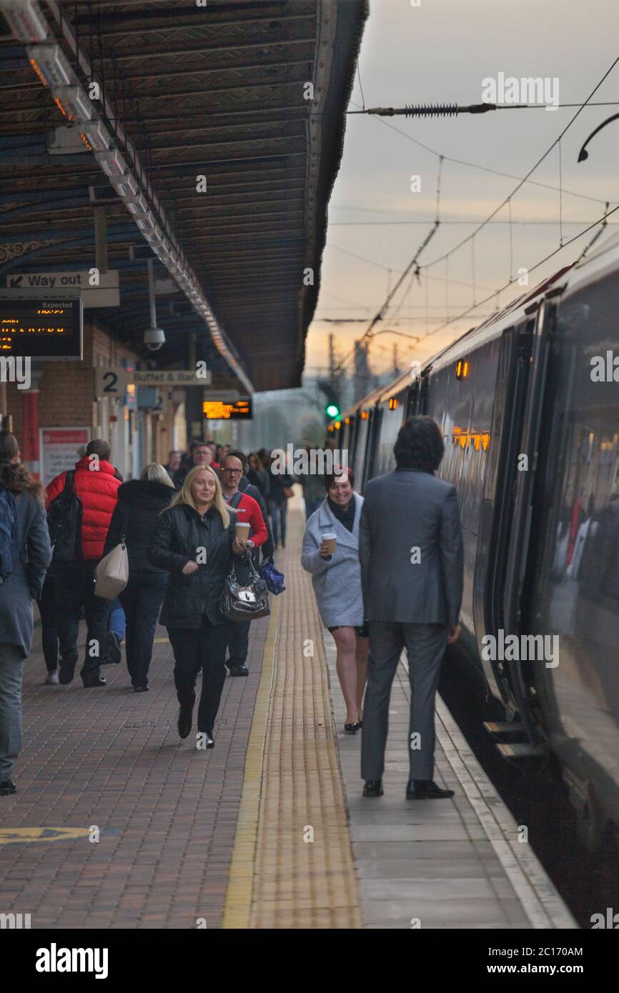 Rail passengers boarding a train at Warrington Bank Quay railway station on the west coast mainline. Stock Photo