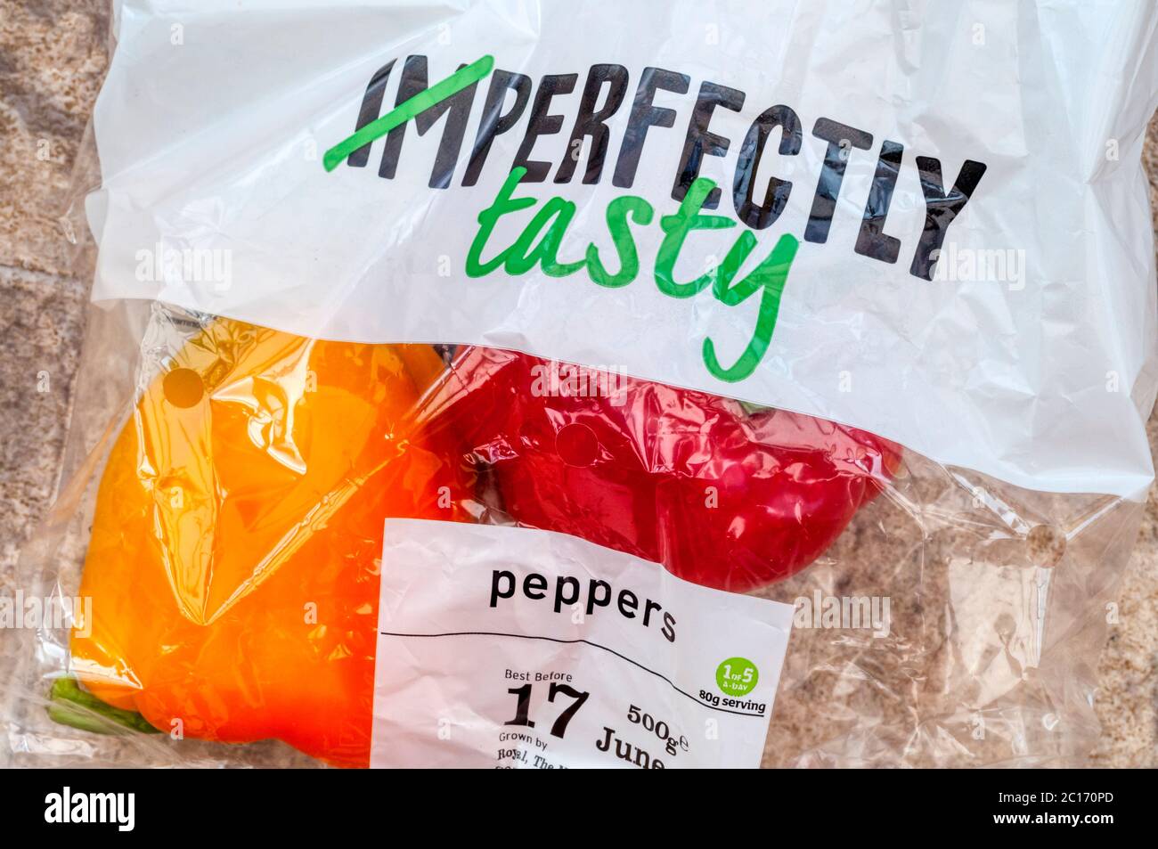 A bag of Sainsbury's Imperfectly Tasty red and yellow peppers. Stock Photo