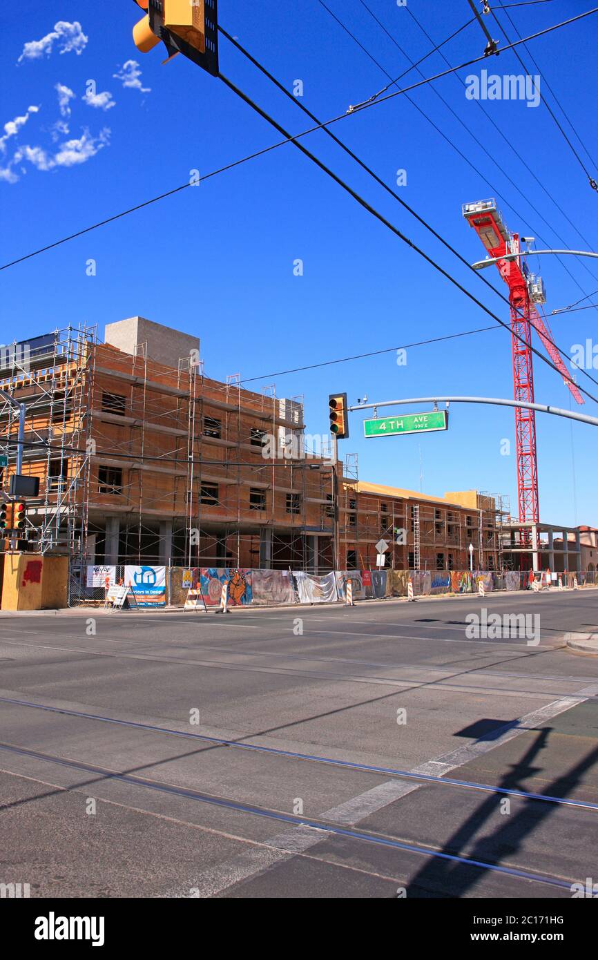 New construction continues in Tucson AZ. Here on the corner of 4th Ave and 6th work is underway on a multi-space project after covid19 Stock Photo
