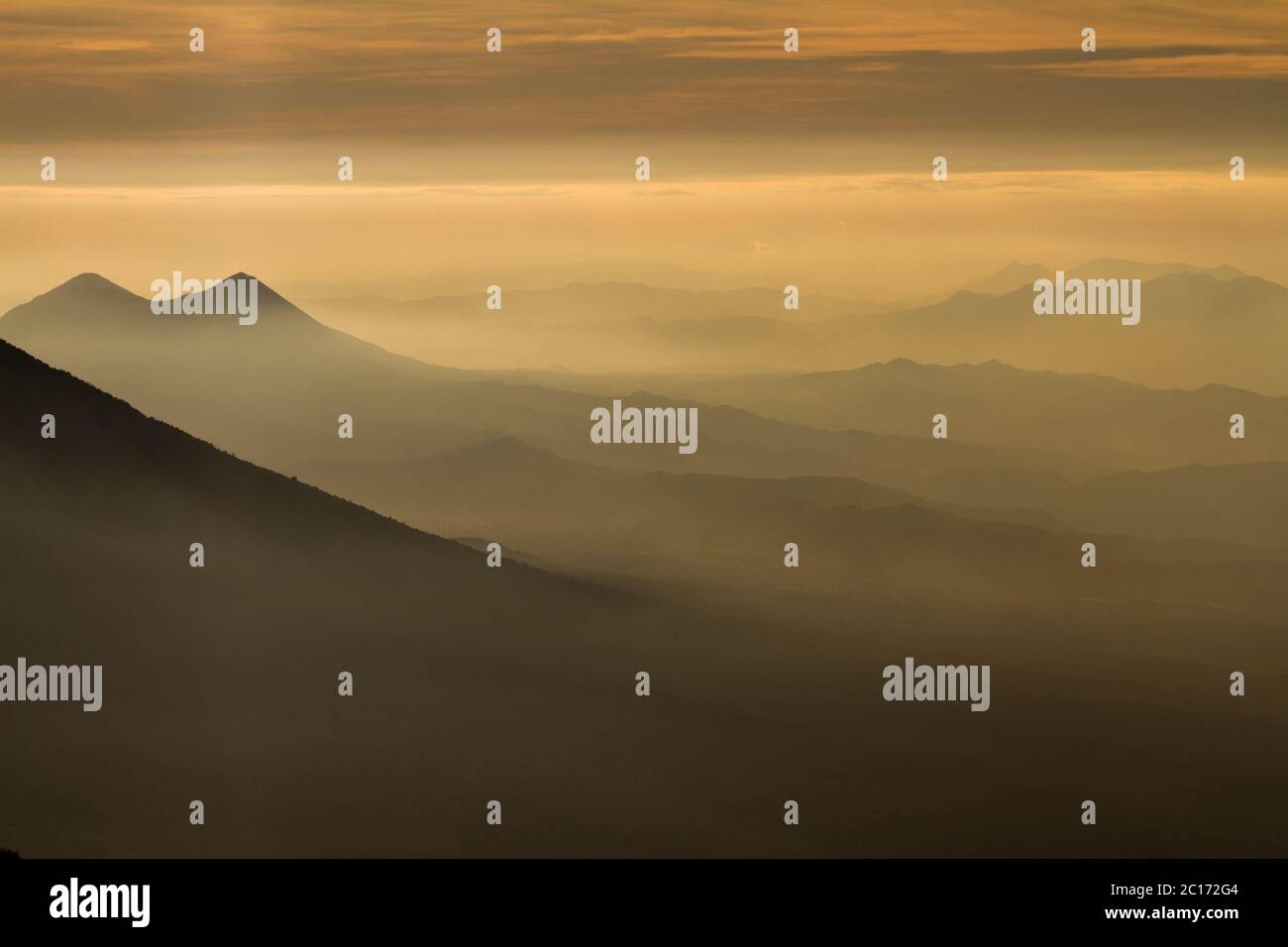 Fog down a valley viewed from Acatenango volcano, Guatemala. - Stock Image