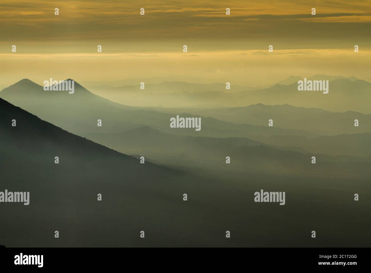 Fog down a valley viewed from Acatenango volcano, Guatemala. - Stock Image