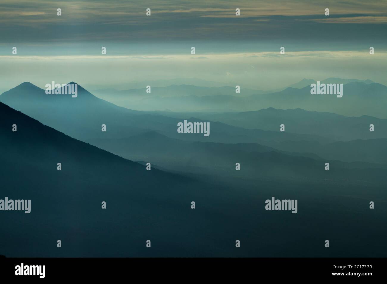 Fog down a valley viewed from Acatenango volcano, Guatemala. - Stock Image