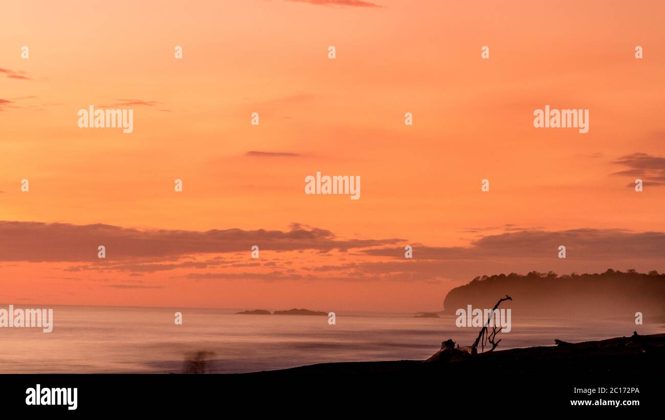 The sun sets on Playa Ostional, a beach home to nesting sea turtles on the Nicoya Peninsula, Costa Rica. - Stock Image