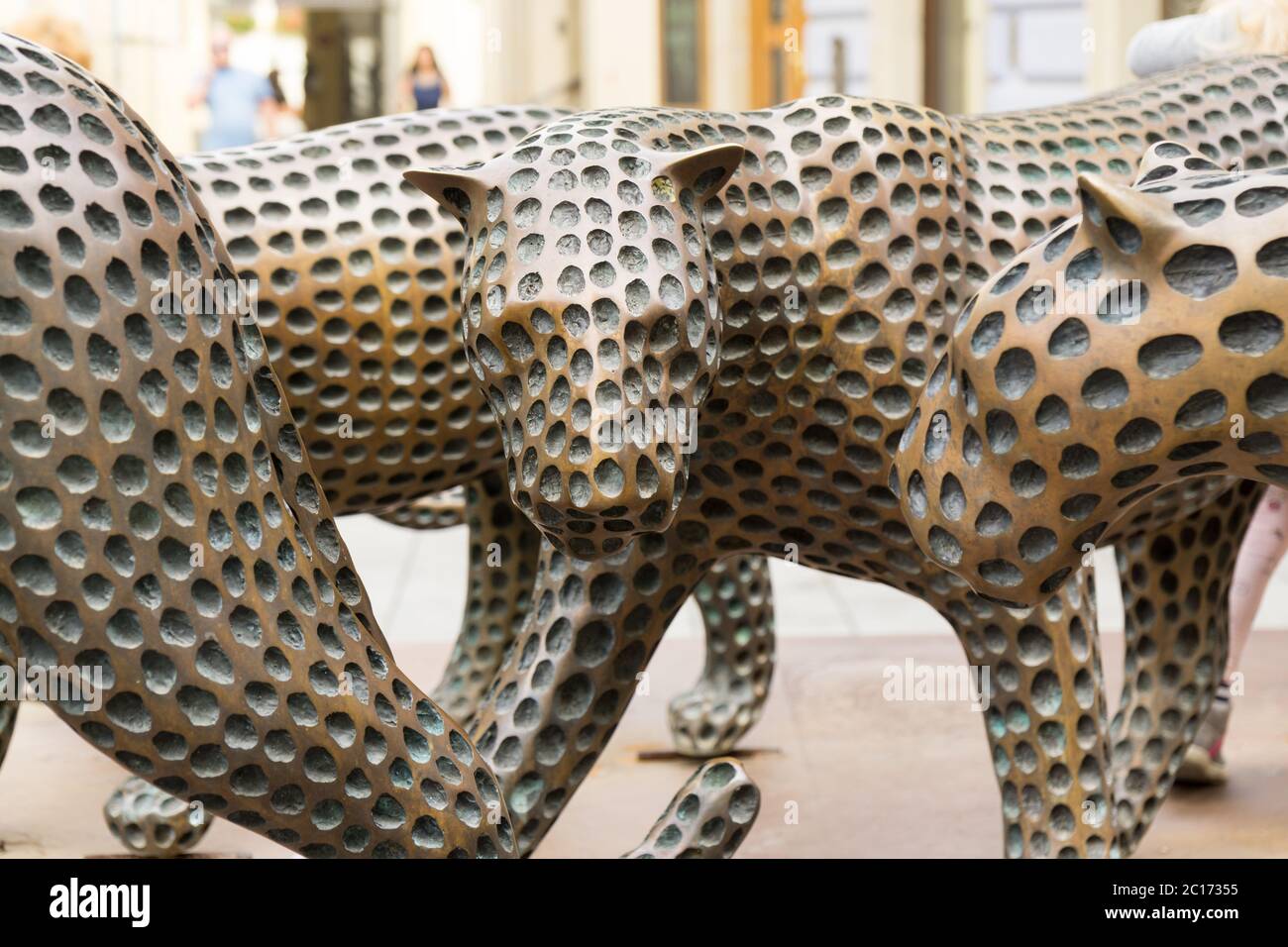 Statues of cheetah on the street Stock Photo