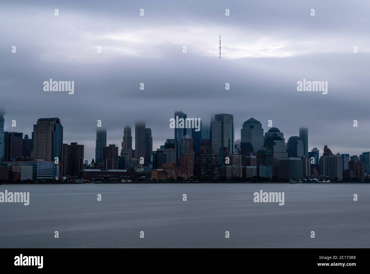 Moody New York City skyline viewed from Hoboken, New Jersey Stock Photo