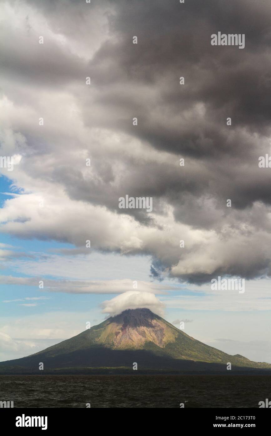 Dark clouds looming over Conception volcano on Ometepe Island, Nicaragua. - Stock Image