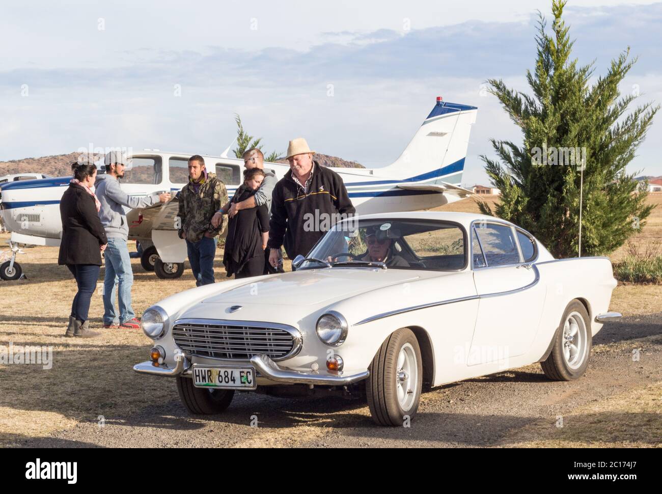 QUEENSTOWN, SOUTH AFRICA - 17 June 2017: Vintage Volvo P1800 car being driven as part of a display a Stock Photo
