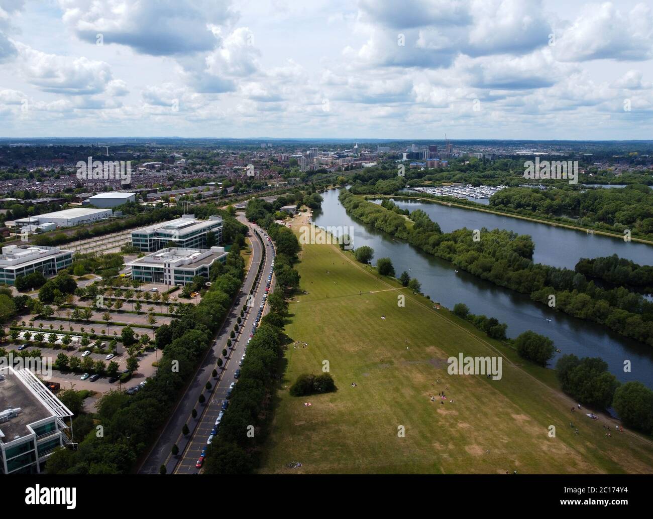 Reading, United Kingdom - June 07 2020: Aerial view along the park and River Thames, past offices and towards the town centre along Thames Valley Park Stock Photo