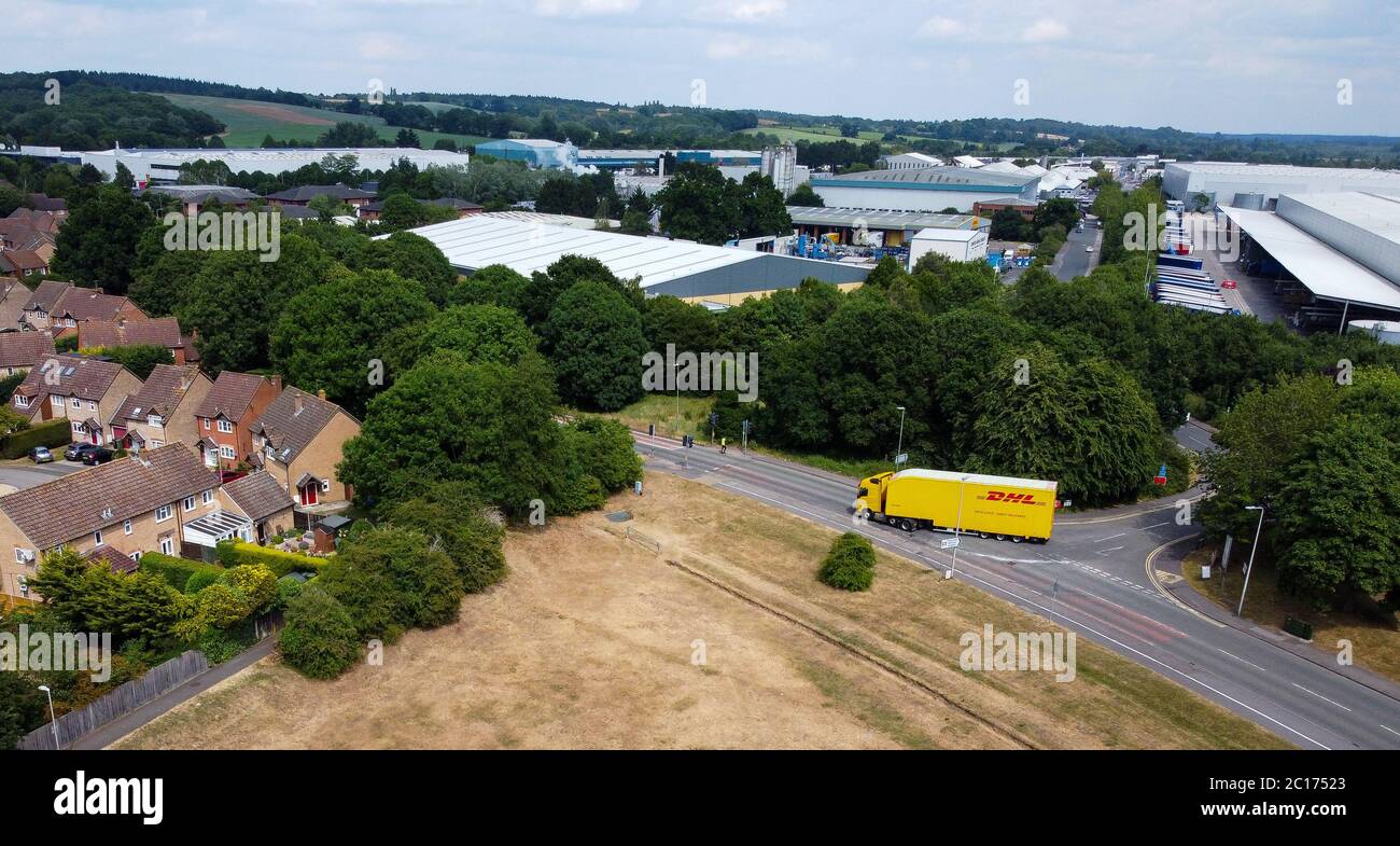 Thatcham, United Kingdom June 09 2020 An aerial shot of a DHL Lorry leaving an industrial