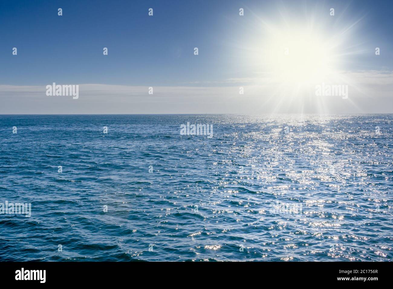Blue sea with sunlight reflected on it - sea background Stock Photo - Alamy
