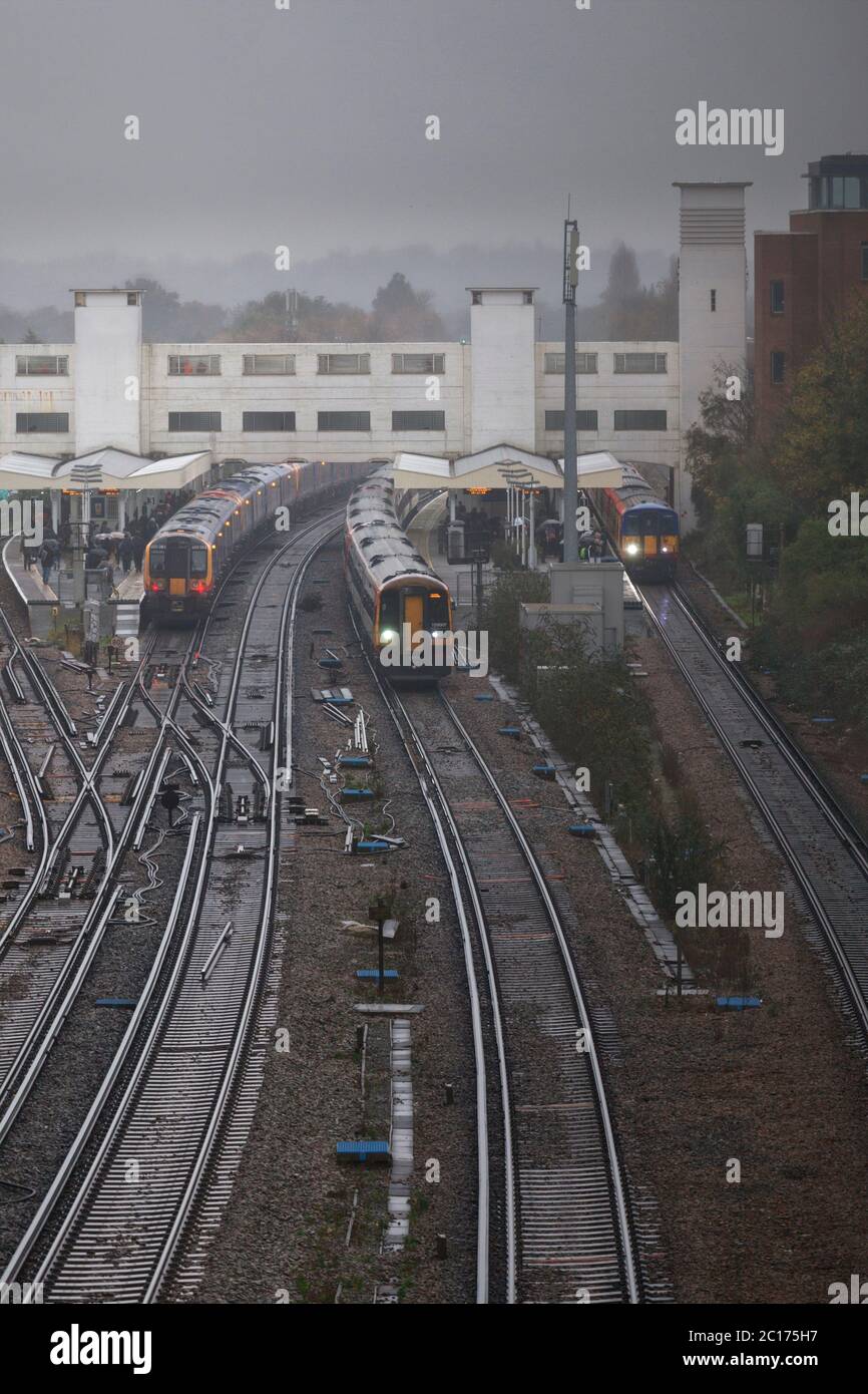South West Trains  passing on the busy congested south western mainline passing Surbiton railway station Stock Photo