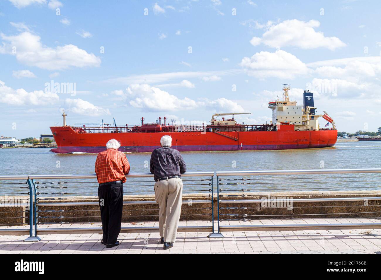 New Orleans Louisiana,Spanish Plaza,Mississippi River,cargo ship,vessel,hull,navigation,commercial shipping,water,waterfront,man men male adult adults Stock Photo