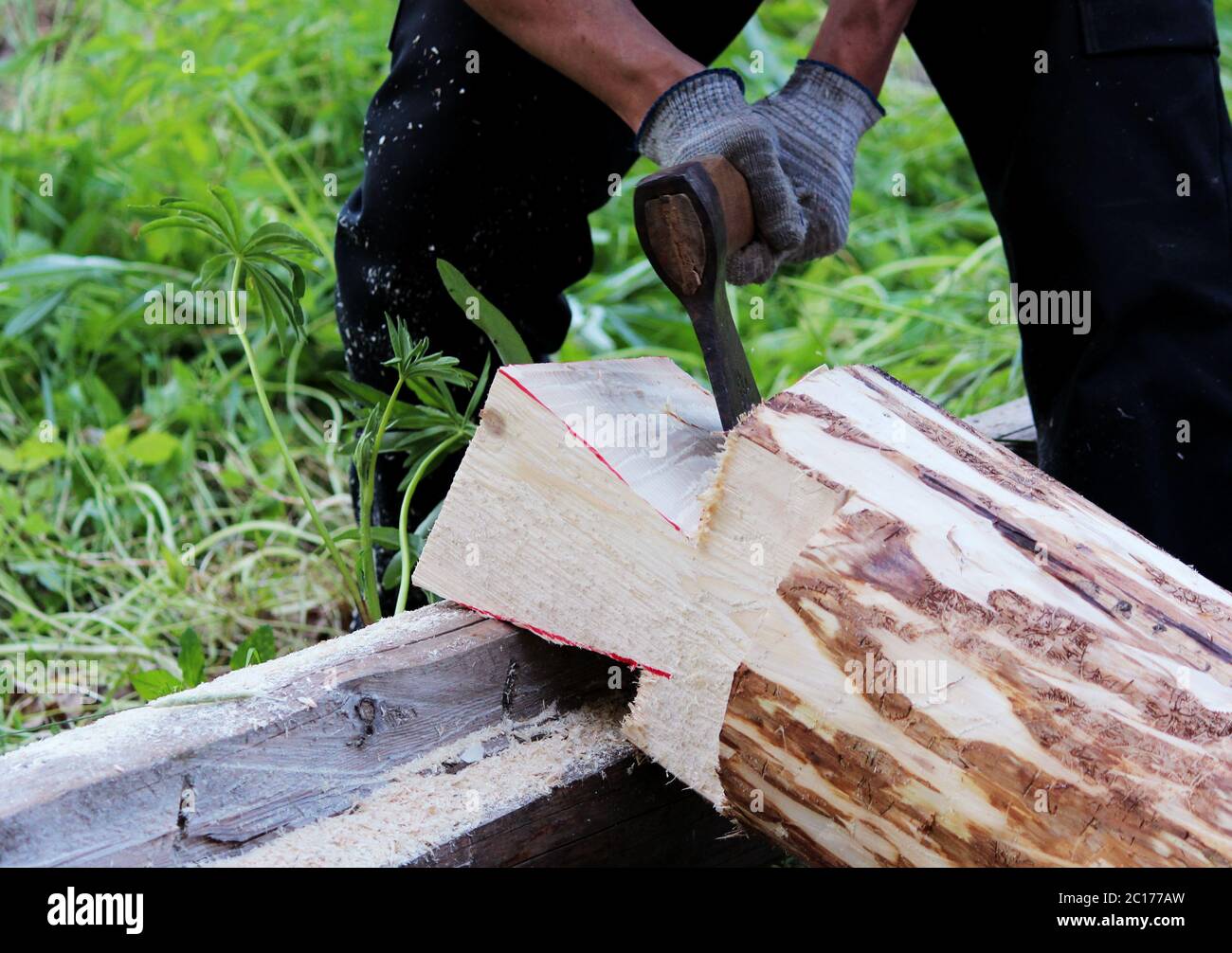 The worker collects a wooden frame with the help of an hacket during ...