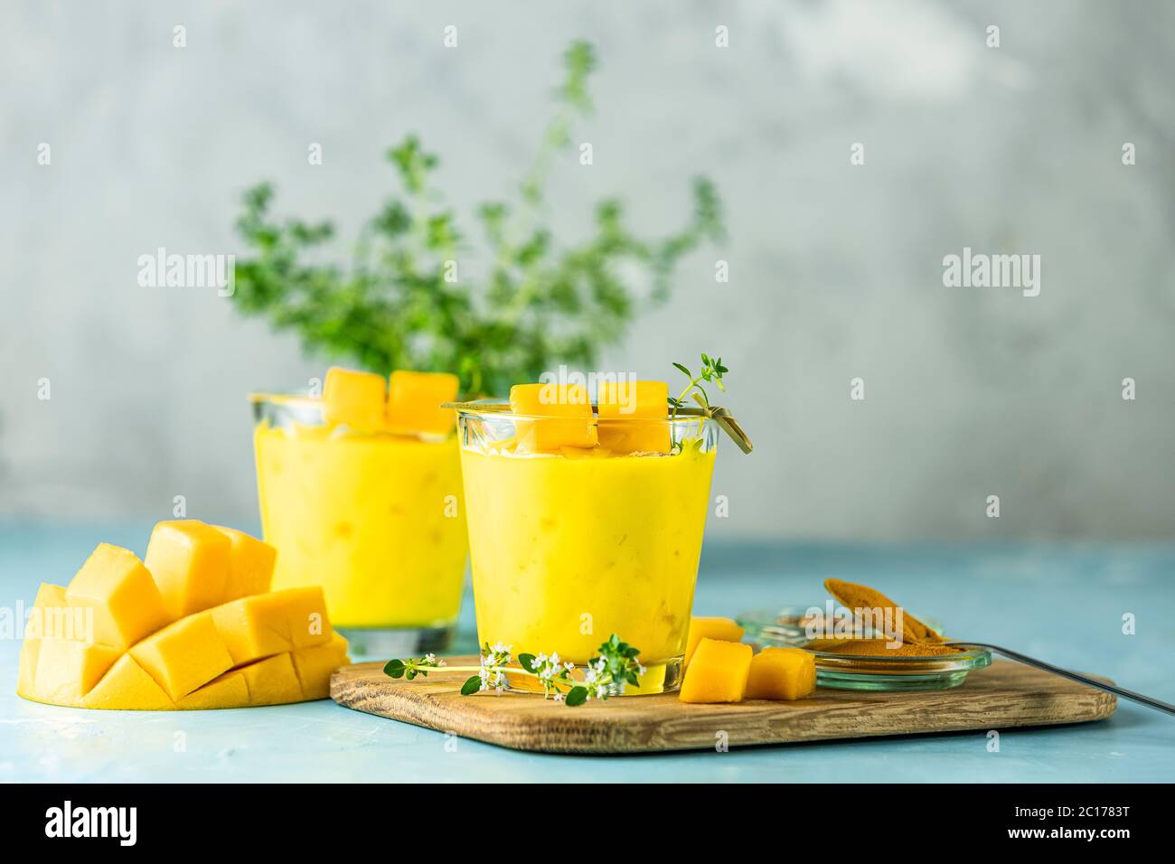 Yellow Indian mango yogurt drink Mango Lassi or smoothie with turmeric and saffron. Healthy
