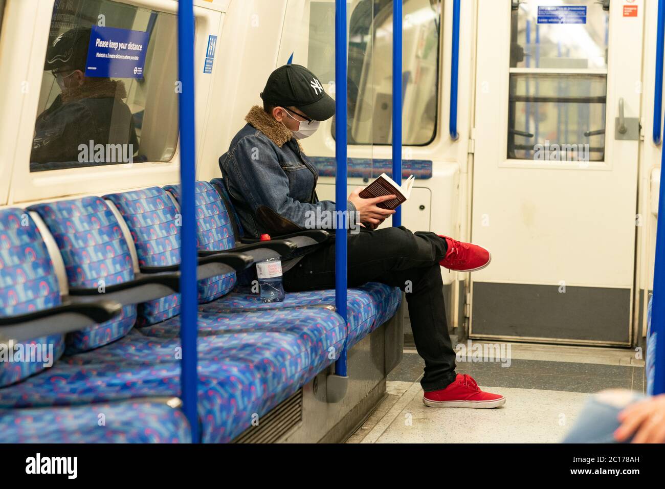 LONDON, ENGLAND JUNE 8, 2020 Young man on a Piccadilly Line London