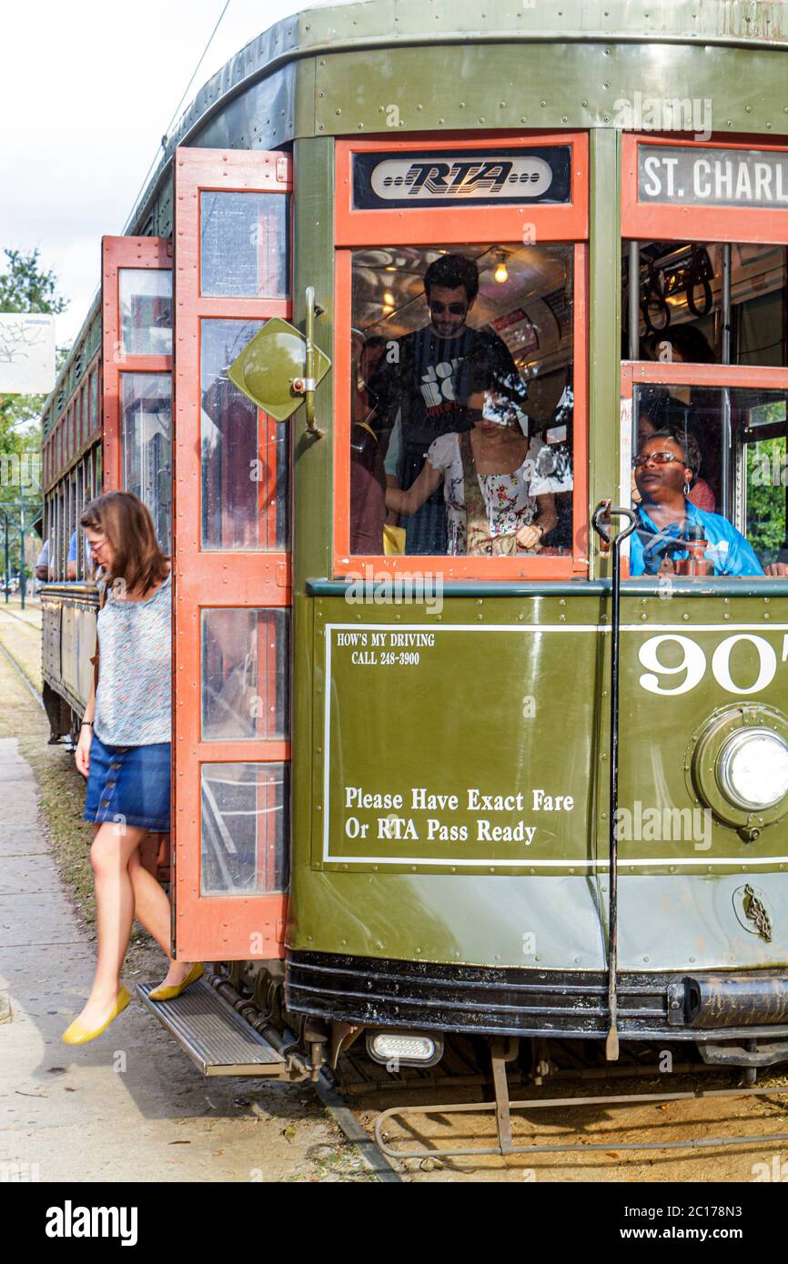 New Orleans Louisiana,Garden District,St. Charles Avenue,Regional Transit Authority,RTA,St. Charles Streetcar Line,tram,trolley,stop,Black woman femal Stock Photo