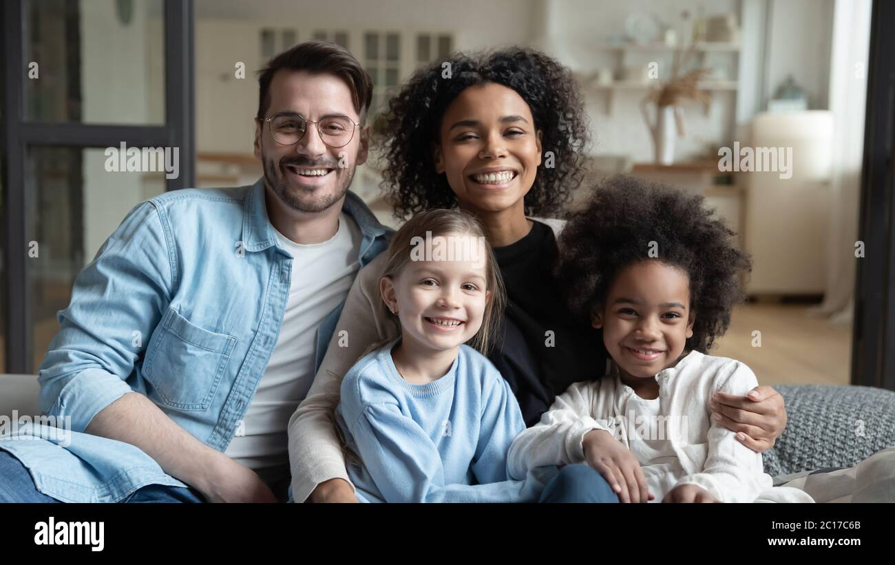 Beautiful multi-ethnic kids and their parents family portrait Stock Photo