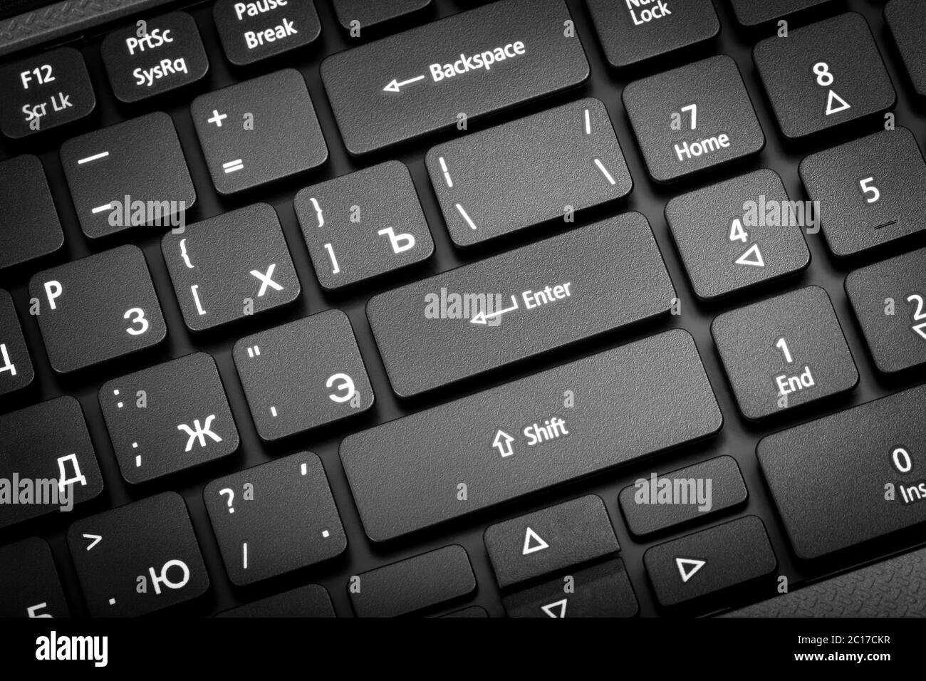 Electronic collection - laptop keyboard. The focus on the Enter key. Stock Photo