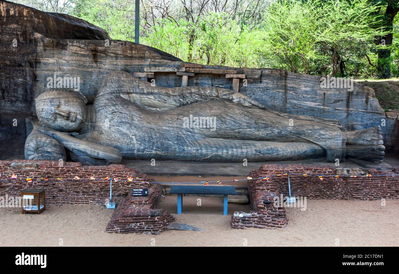 The reclining Buddha statue of Gal Vihara at the ancient site of Polonnaruwa in Sri Lanka. It is carved out of a single slab of granite rock. Stock Photo