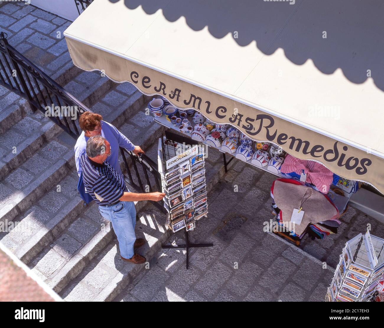 Couple looking at postcards in souvenir shop, Mijas, Costa del Sol, Malaga Province, Andalusia (Andalucia), Spain Stock Photo