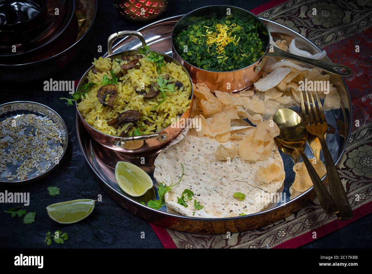 Vegan North Indian mushroom pilaf and spinach served in traditional bowls Stock Photo