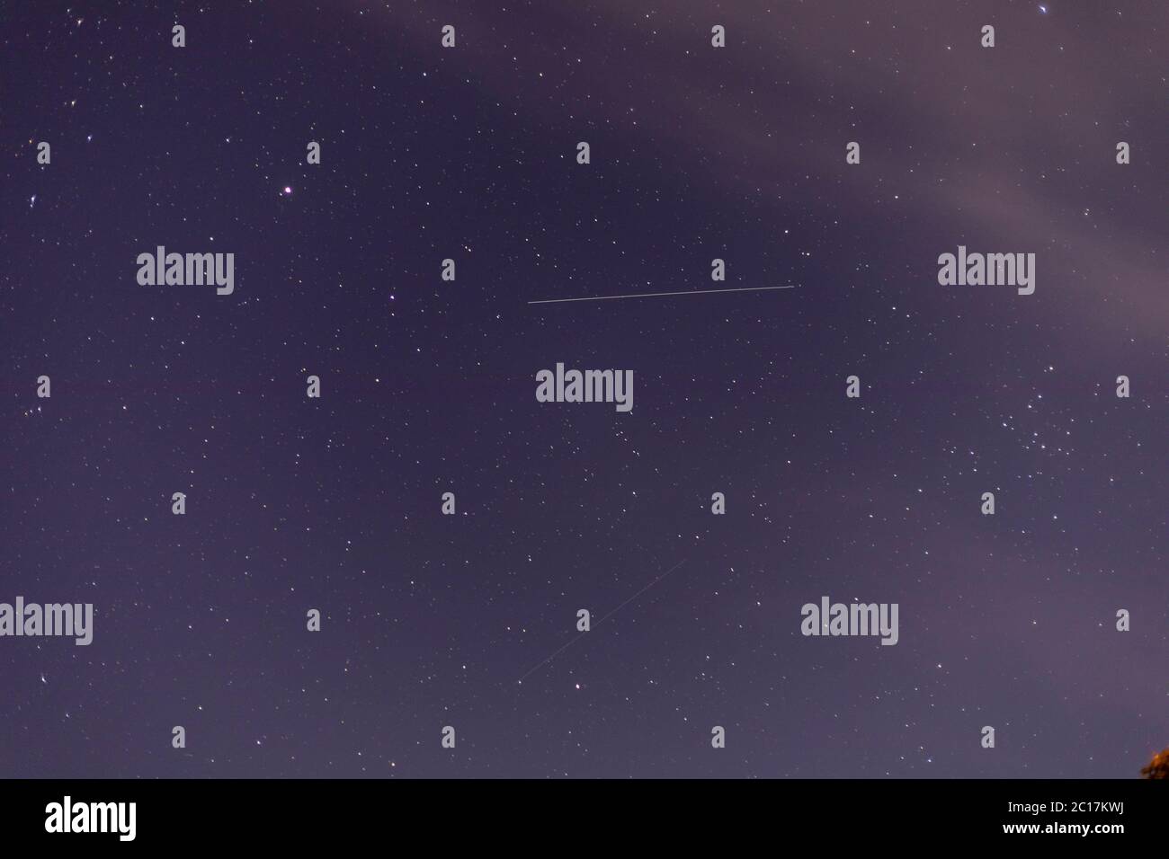 Hailsham, UK. 14th Jun 2020. Starlink satellites seen over clear skies this evening in East Sussex. The satellites are constructed by Spacex and aim to provide internet access across the globe. Hailsham, East Sussex,UK. Credit: Ed Brown/Alamy Live News Stock Photo