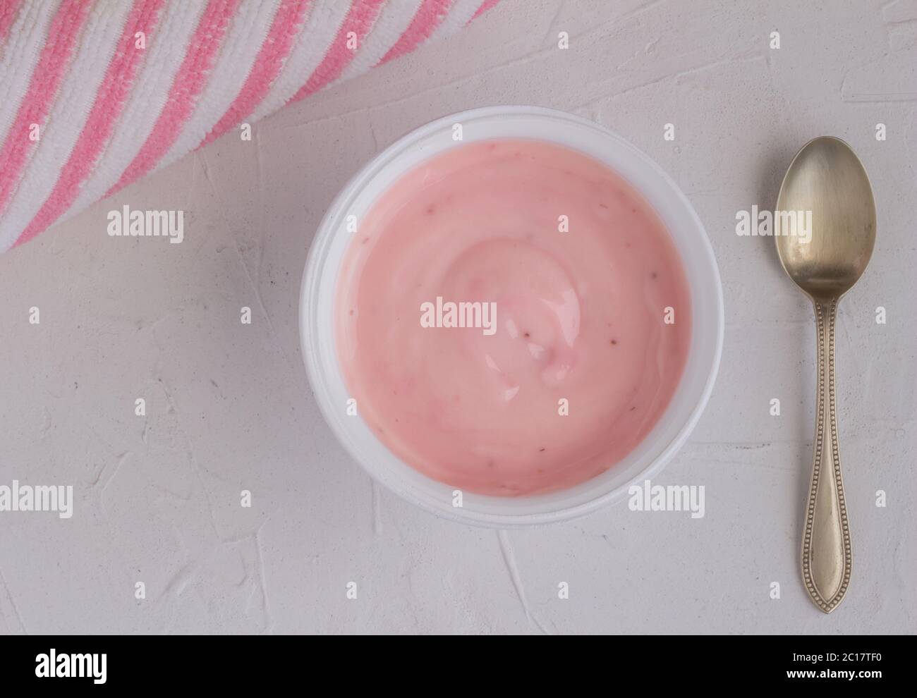 Healthy strawberry fruit flavored yogurt with natural coloring in