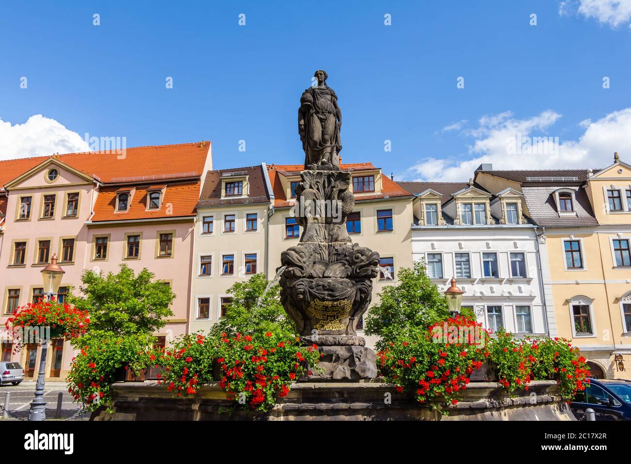 Statue and waterspout fountain in the old town of Zittau, Germany Stock Photo