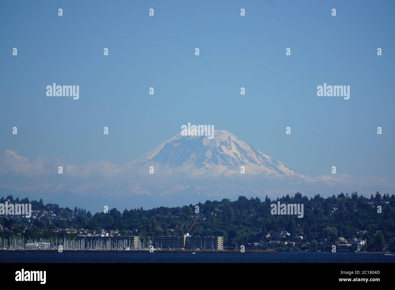Seattle, Washington: Mt. Rainier seems to float in mid-air above Elliott Bay. Stock Photo