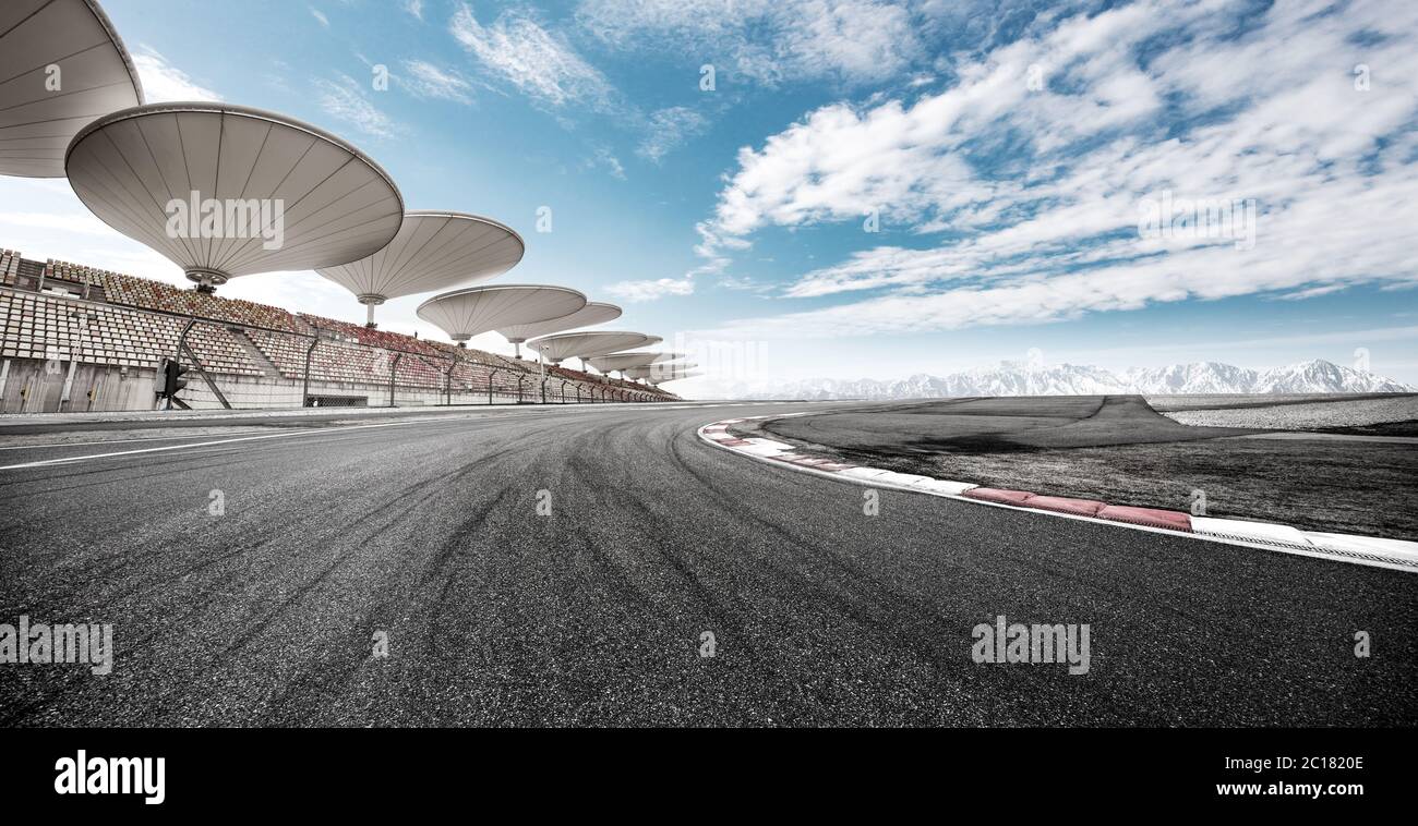 empty asphalt car racing track in blue cloud sky Stock Photo - Alamy