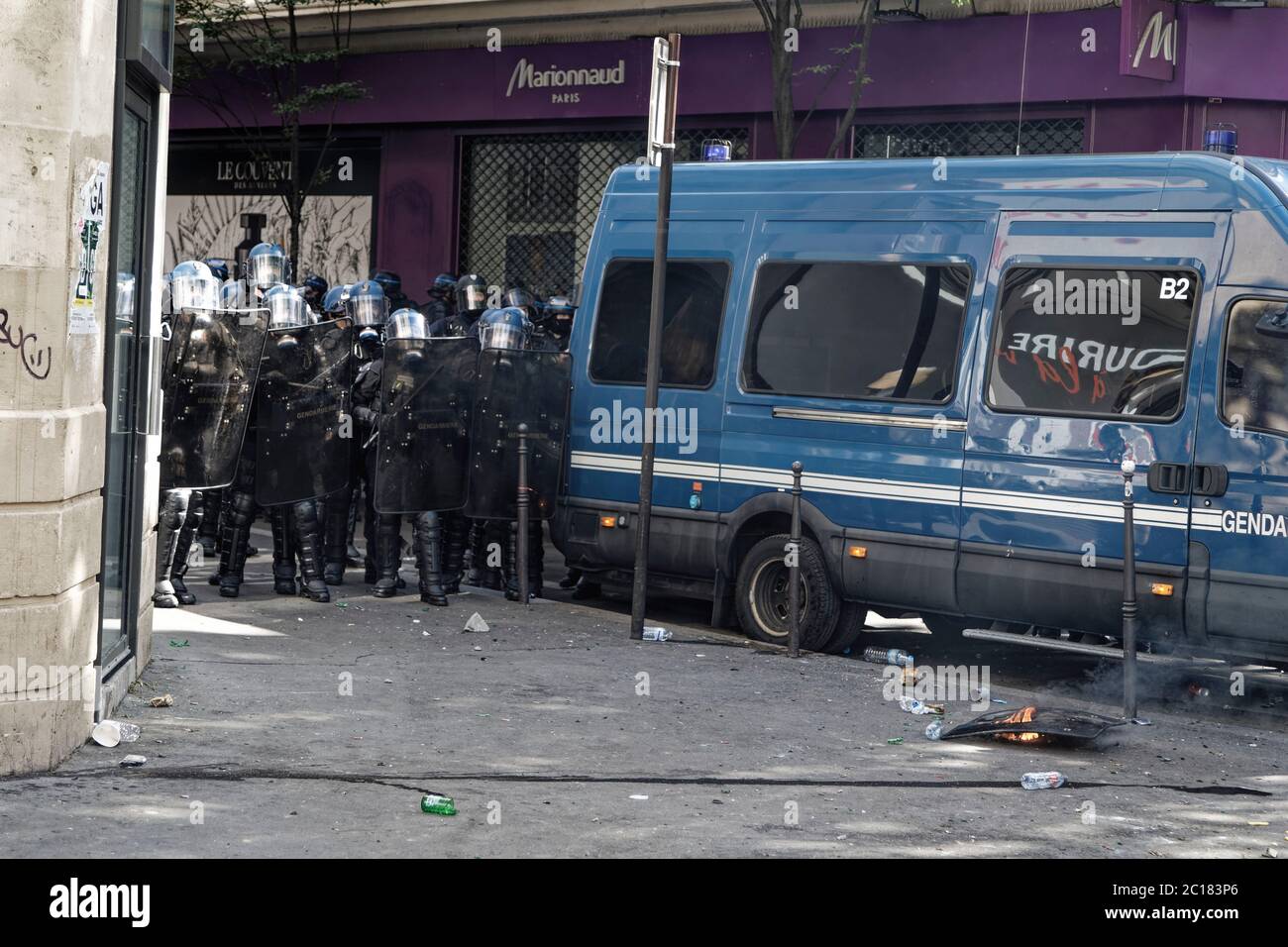 Paris, France. 13th June, 2020. Protesters burn a shield they took from riot police during the demonstration organized by the Adama Committee in Paris. Stock Photo