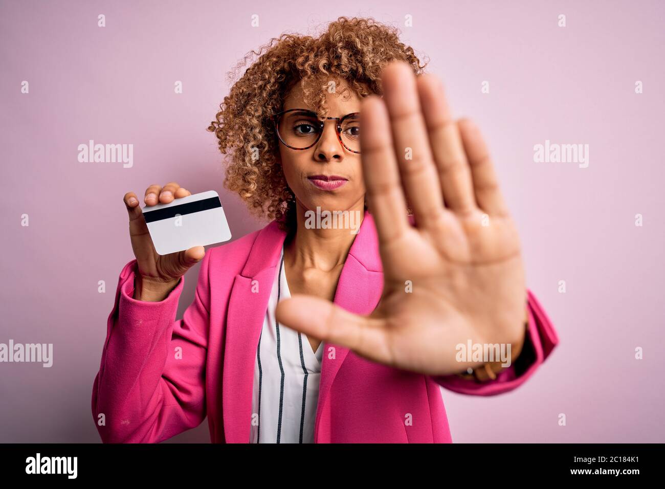 Young african american business woman holding id card identification