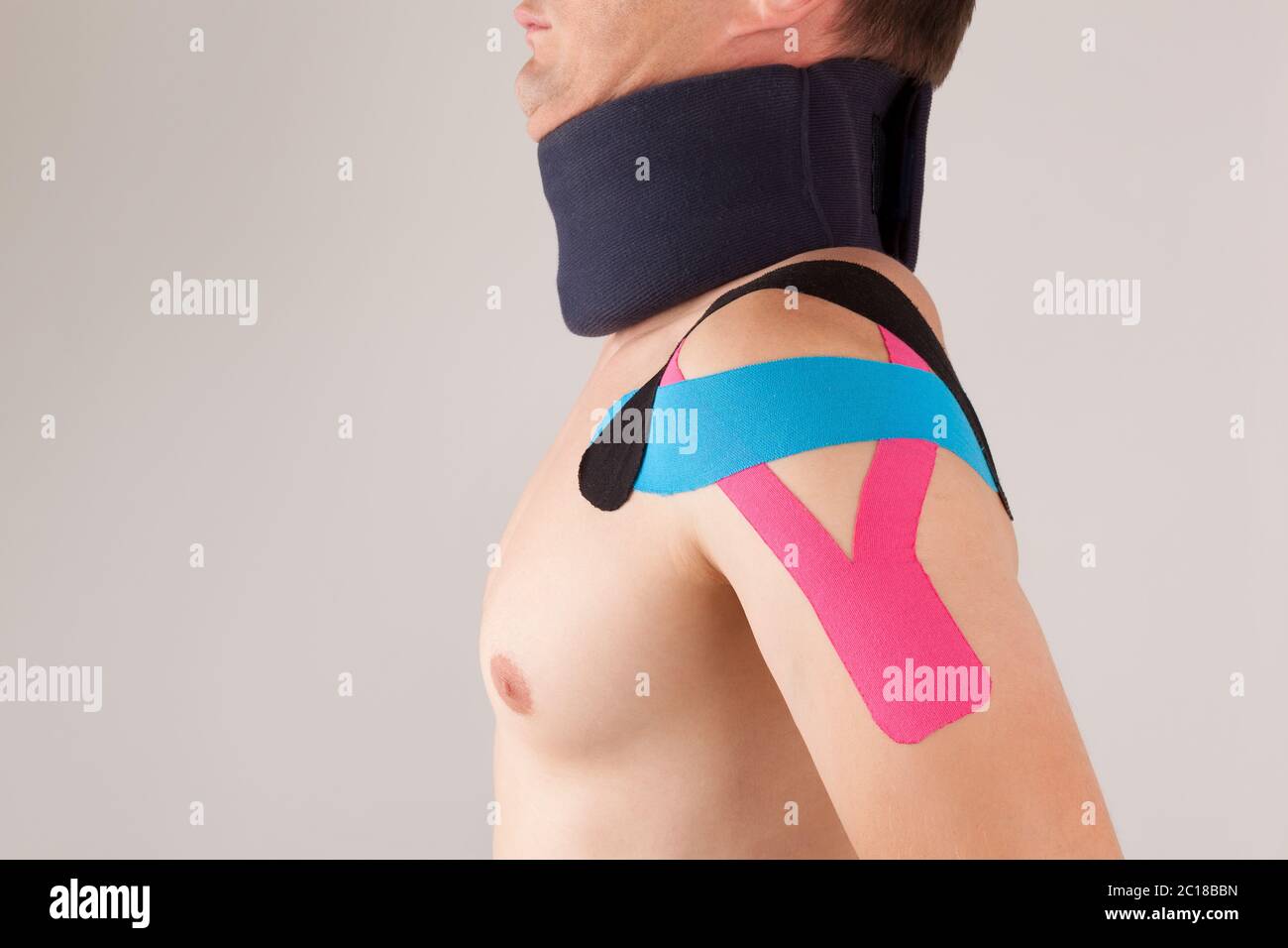 Kinesio taping for stabilizing shoulder Stock Photo