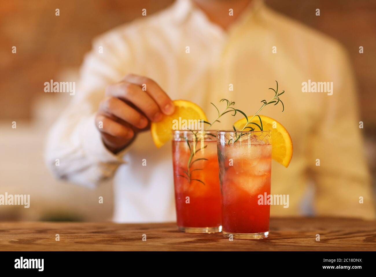 Bartender making two cocktails Stock Photo - Alamy