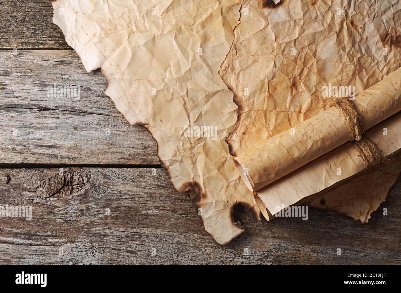 Old paper with the burned edges Stock Photo