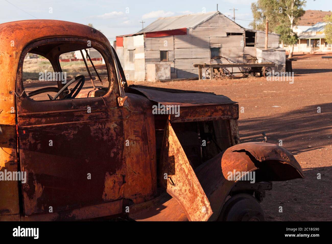 Rusty truck and corrugated iron house of the historical gold mining town Gwalia, Leonora Western Australia Stock Photo