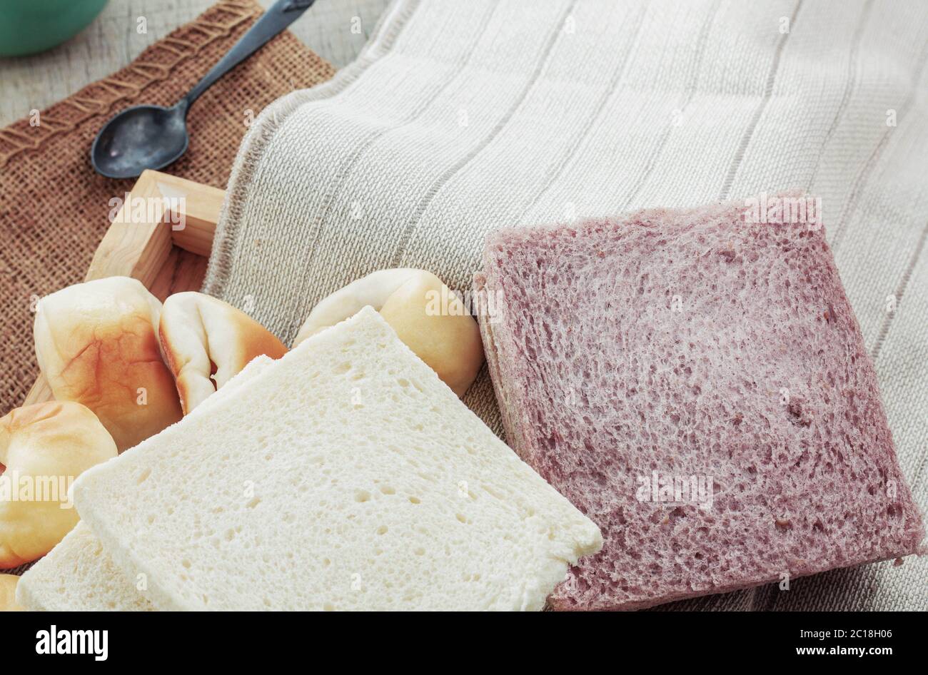 breads and cups on tablecloth. Stock Photo