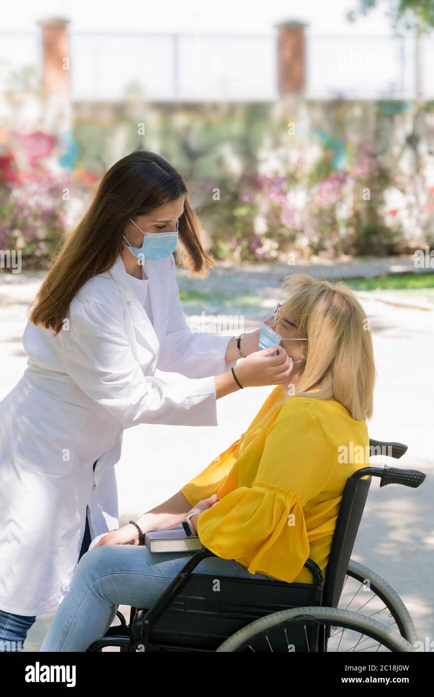 Woman assistant puts on hi-res stock photography and images - Alamy