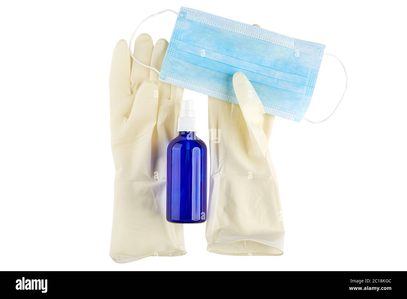 Antiseptic spray, blue medical face mask and sterile rubber gloves