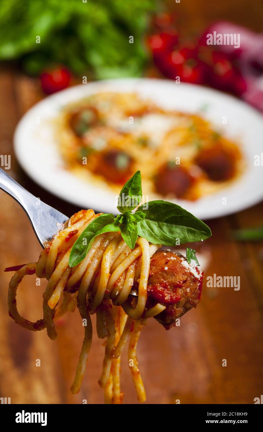 Fork with spaghetti basil and meatball Stock Photo Alamy