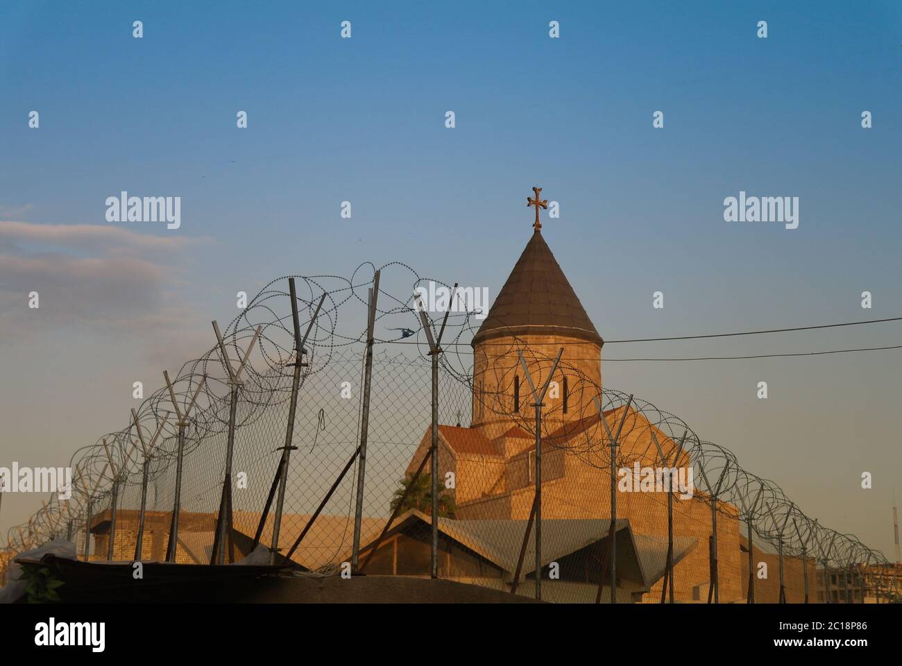 Armenian church behind barbed wire, Baghdad Iraq Stock Photo