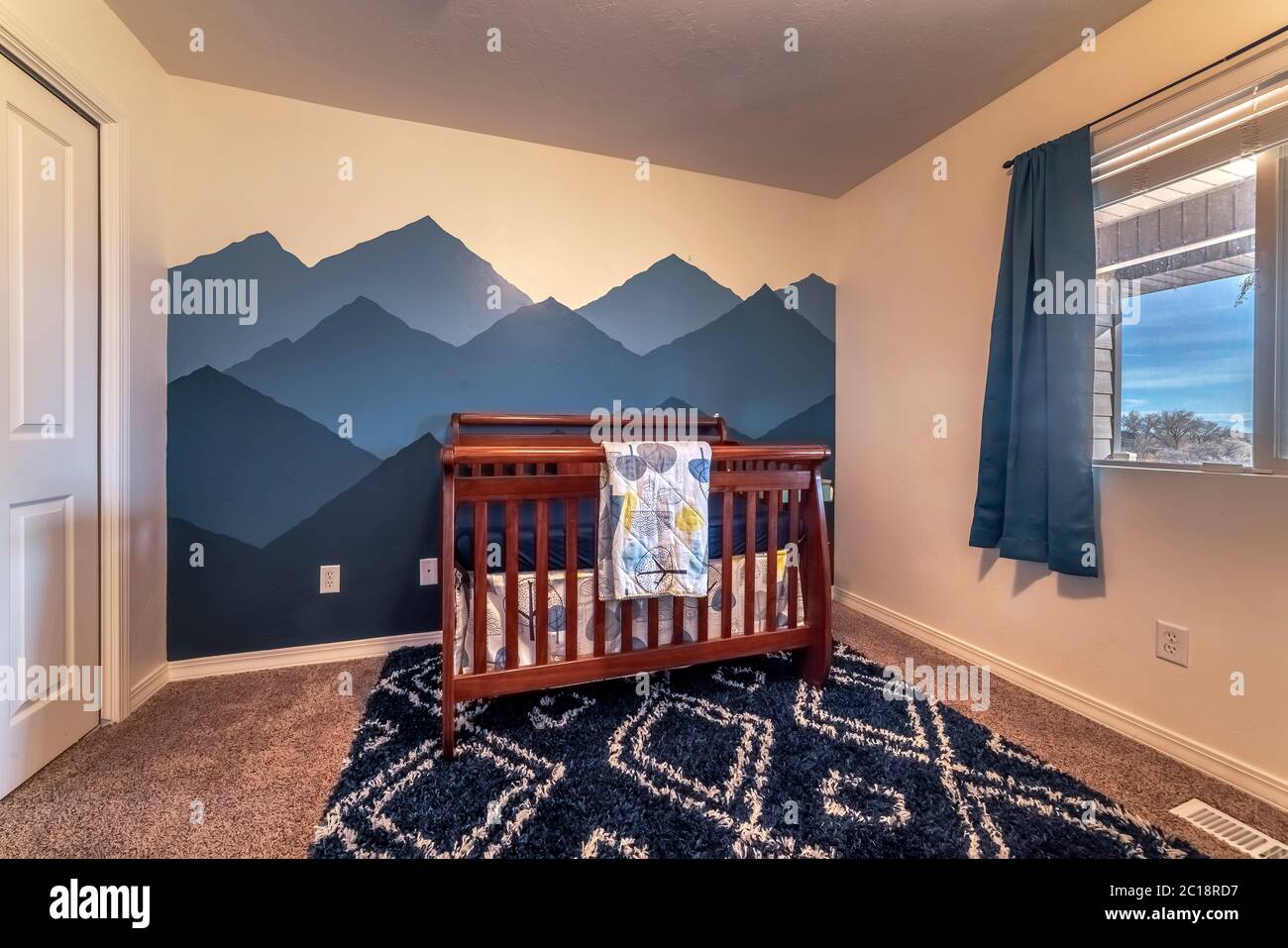 Bedroom interior with mountain peaks mural interior Stock Photo - Alamy