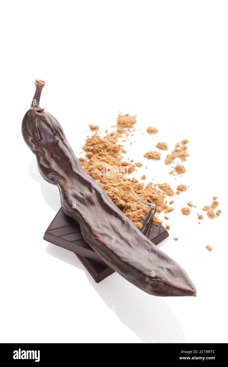 Carob powder, pod and chocolate isolated Stock Photo Alamy