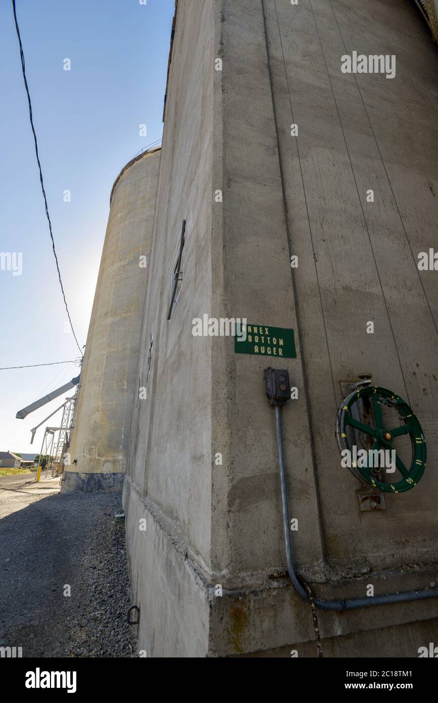 A concrete grain elevator with mechanical and electrical controls Stock