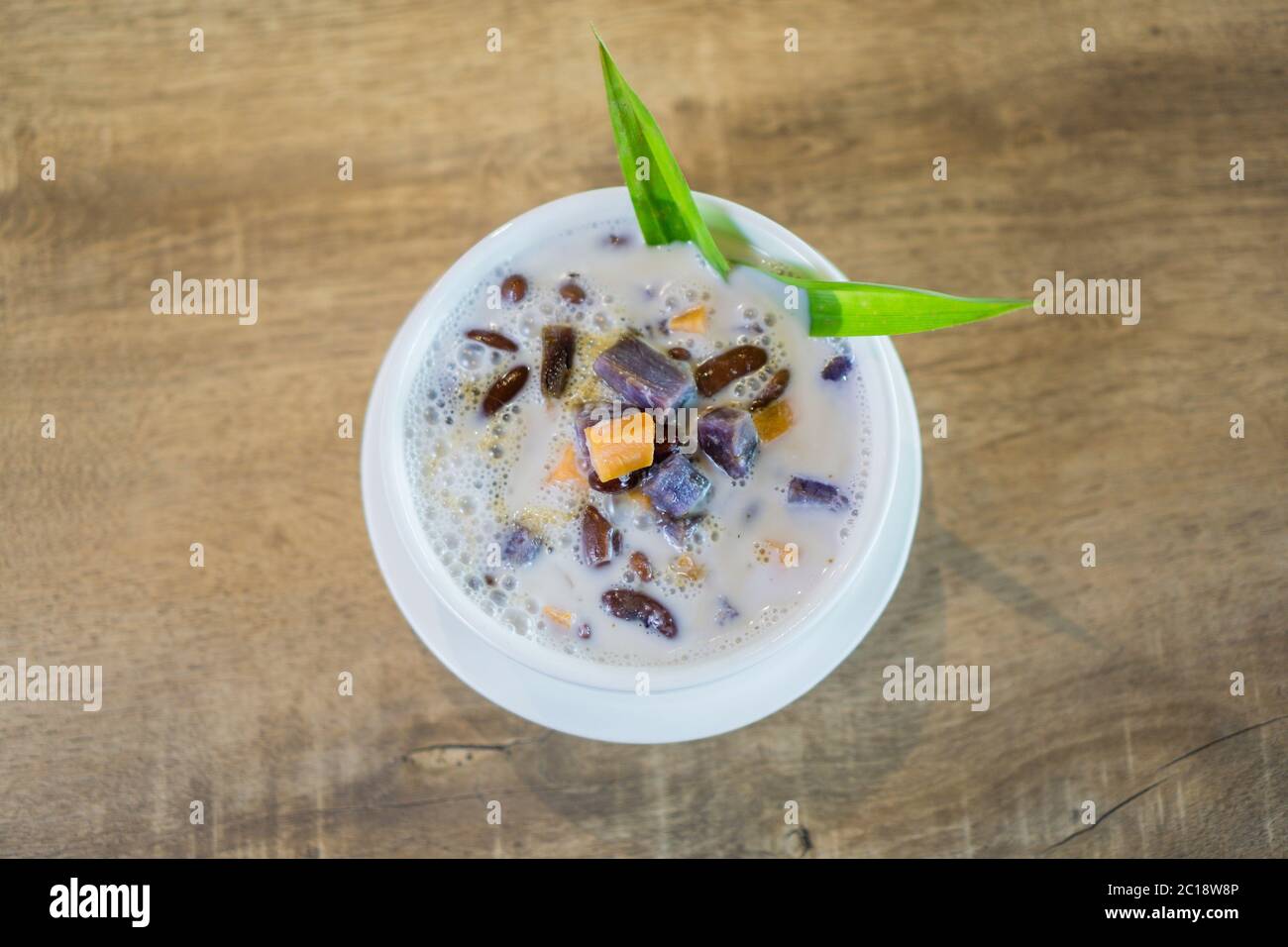 Bubur Cha Cha, Malay dessert made from tapioca pearls, sweet potato, taro and coconut milk. Stock Photo