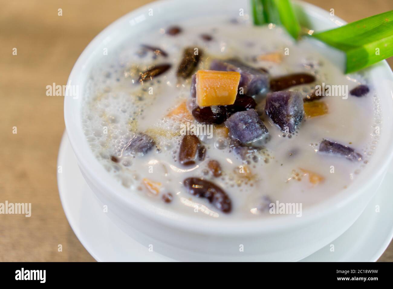 Bubur Cha Cha, Malay dessert made from tapioca pearls, sweet potato, taro and coconut milk. Stock Photo