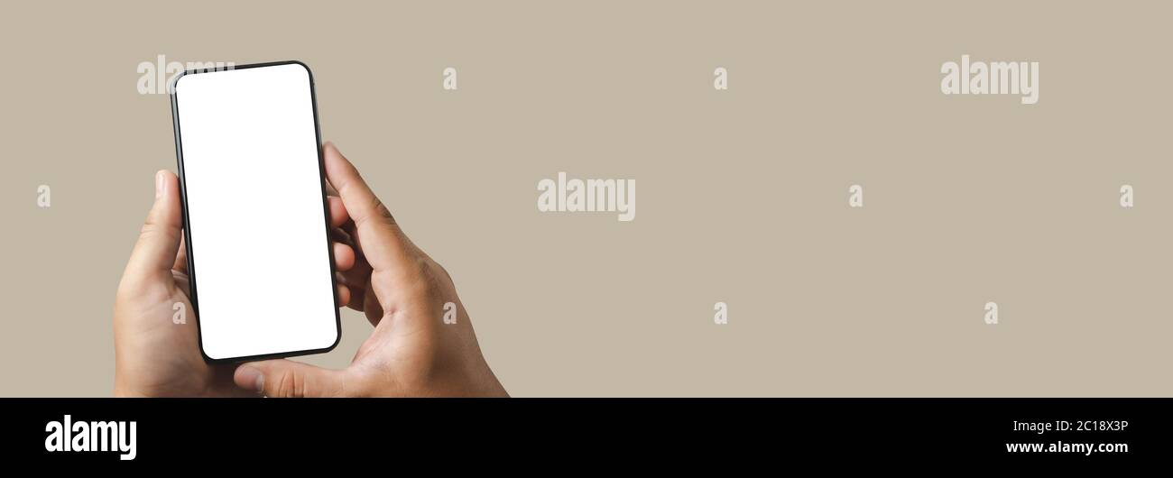 man using  Mock up a Cell Phone With Blank Screen space banner Stock Photo
